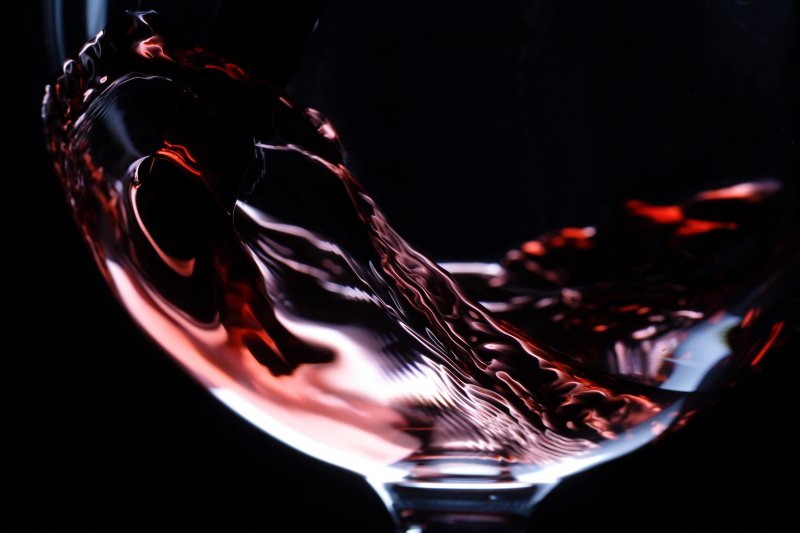 A swirling glass of red wine